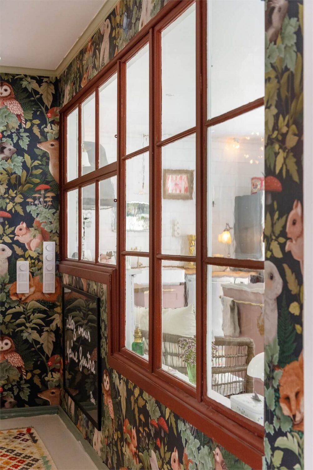 A Bright Open-Plan Swedish Home with a Pink Kitchen 17 large window with red trimmings