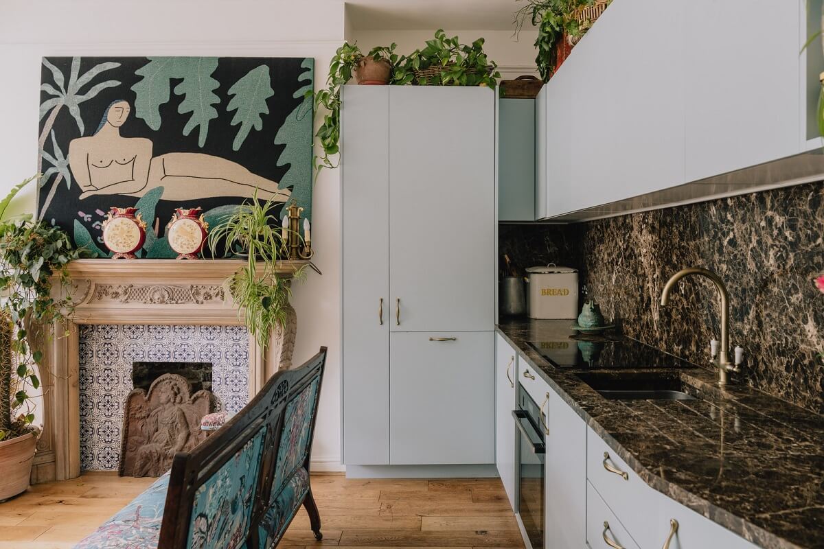 Plants, Art, and a Huge Bay Window in a London Apartment 8 light blue kitchen cabinets in open plan living space nordroom