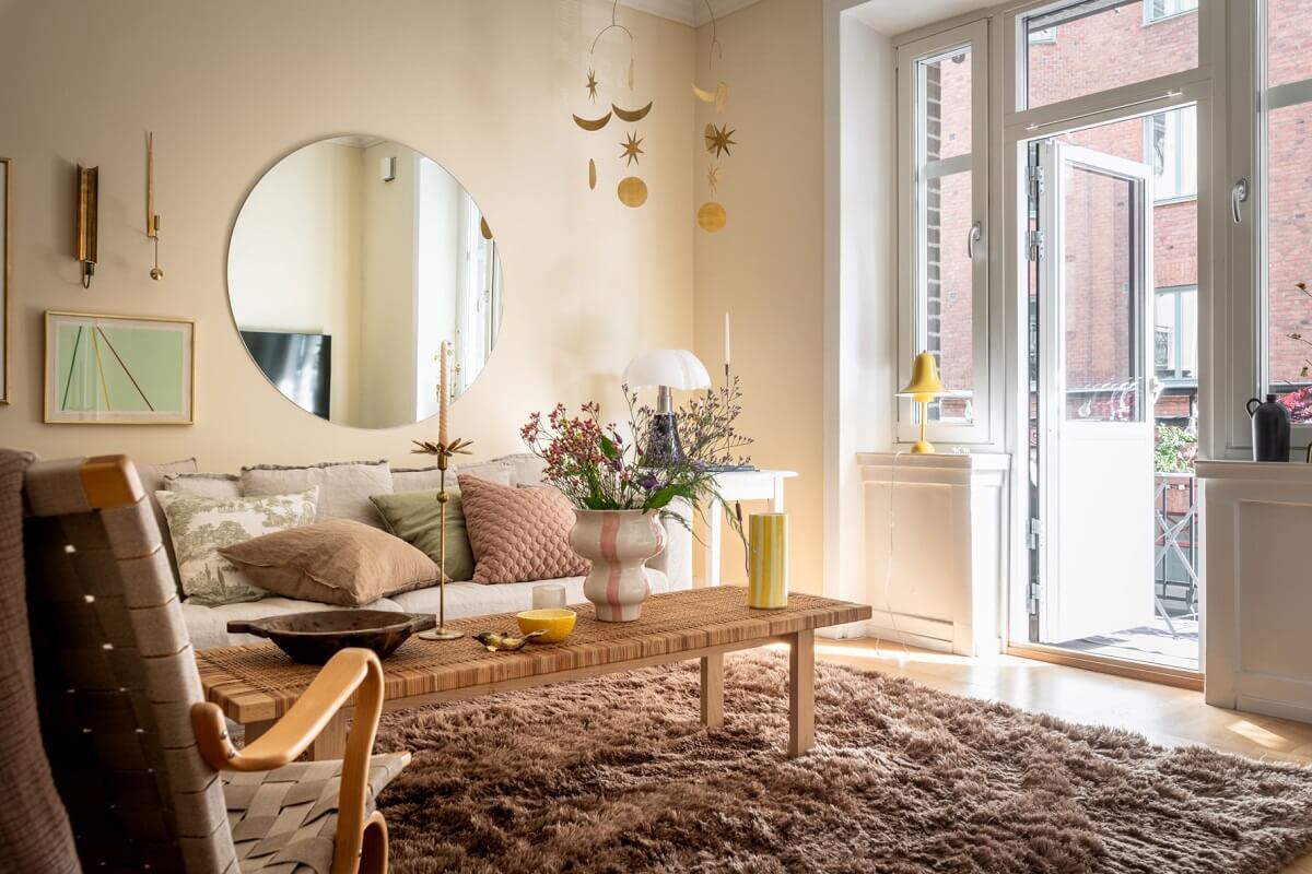 A Scandinavian Apartment with a Pale Yellow Living Room 6 light filled living room with balcony