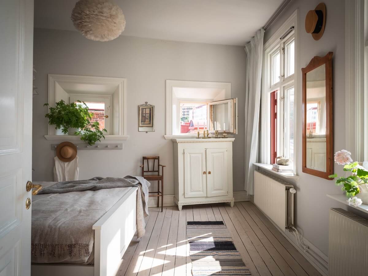 Charming Vintage Country Style in a Family Apartment in Sweden 19 light gray bedroom with natural light