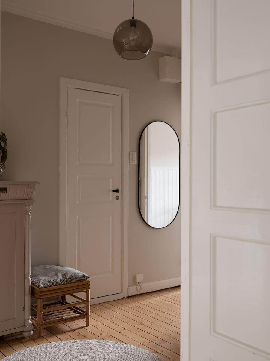 A Beautiful Renovated Maisonette Home with a Calm Color Palette 14 light gray hallway