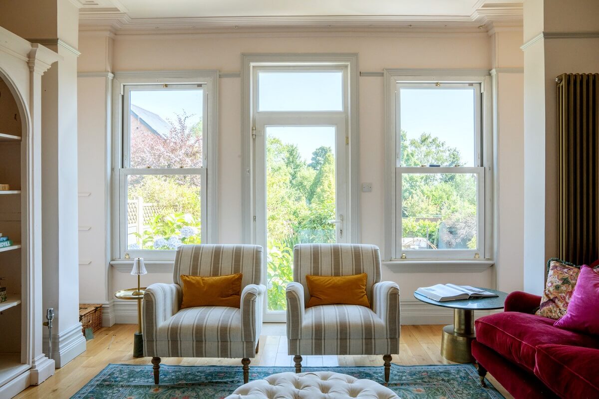 A Beautiful Edwardian House with Period Features 2 light living room pink sofa
