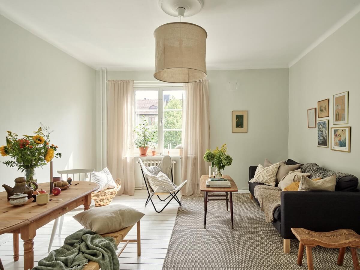 A Small Apartment with a Bright Open-Plan Kitchen & Bedroom 11 light living room white floorboards