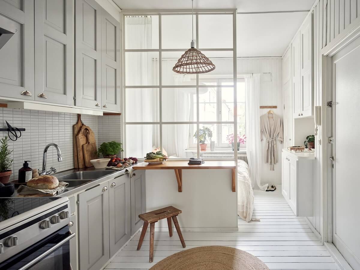 A Small Apartment with a Bright Open-Plan Kitchen & Bedroom 1 light open kitchen with white floor glass wall dividing bedroom nordroom
