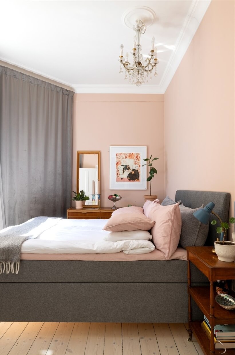 A Lovely Stockholm Apartment with a Black Kitchen and Pink Bedroom 21 light pink bedroom with gray curtains