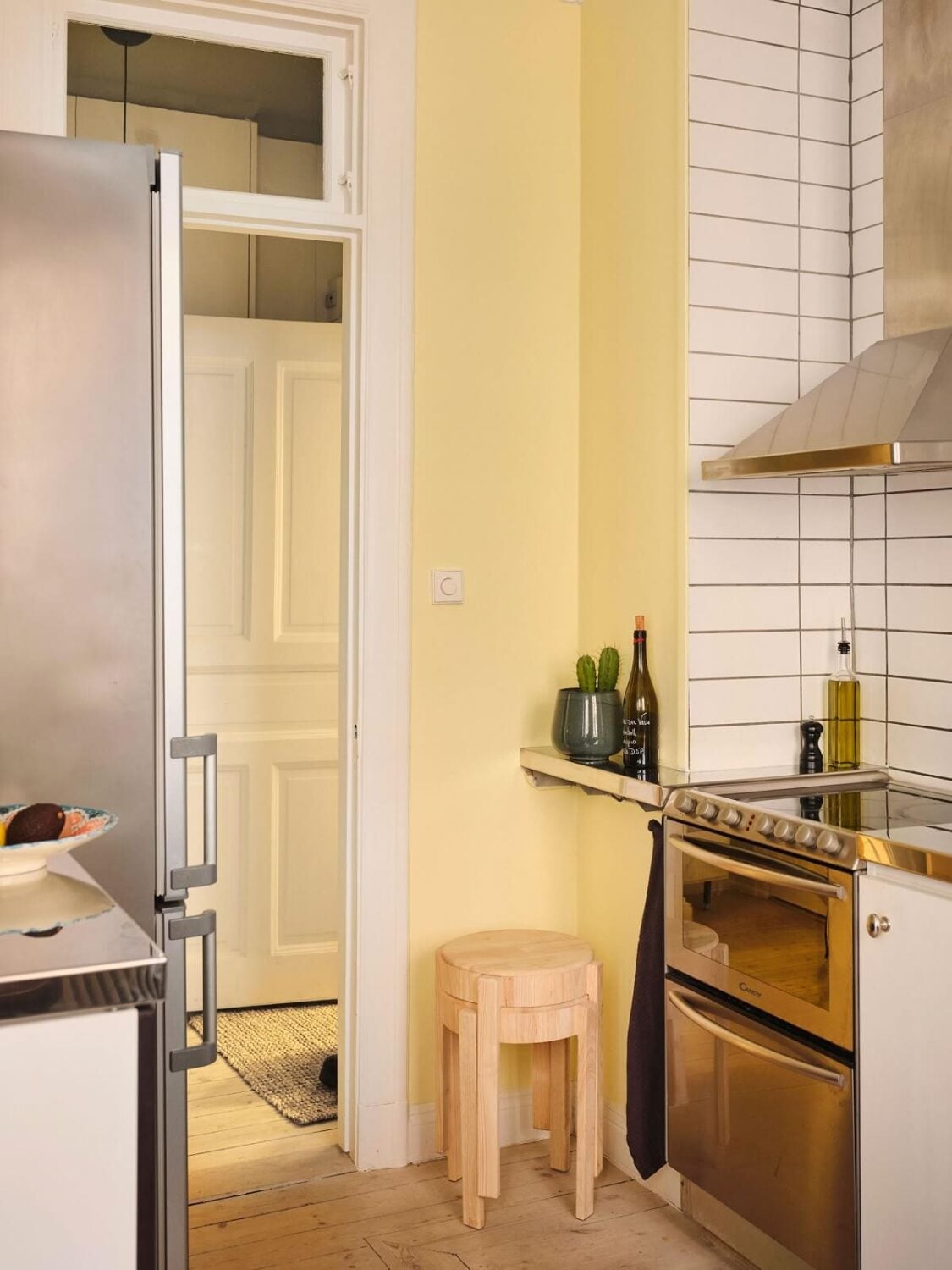 A Small Apartment with Calm Brown, Green, and Yellow Walls 10 light yellow walls kitchen nordroom