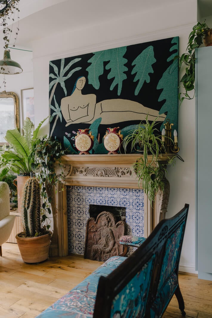 Plants, Art, and a Huge Bay Window in a London Apartment 9 living room fireplace with large artwork nordroom