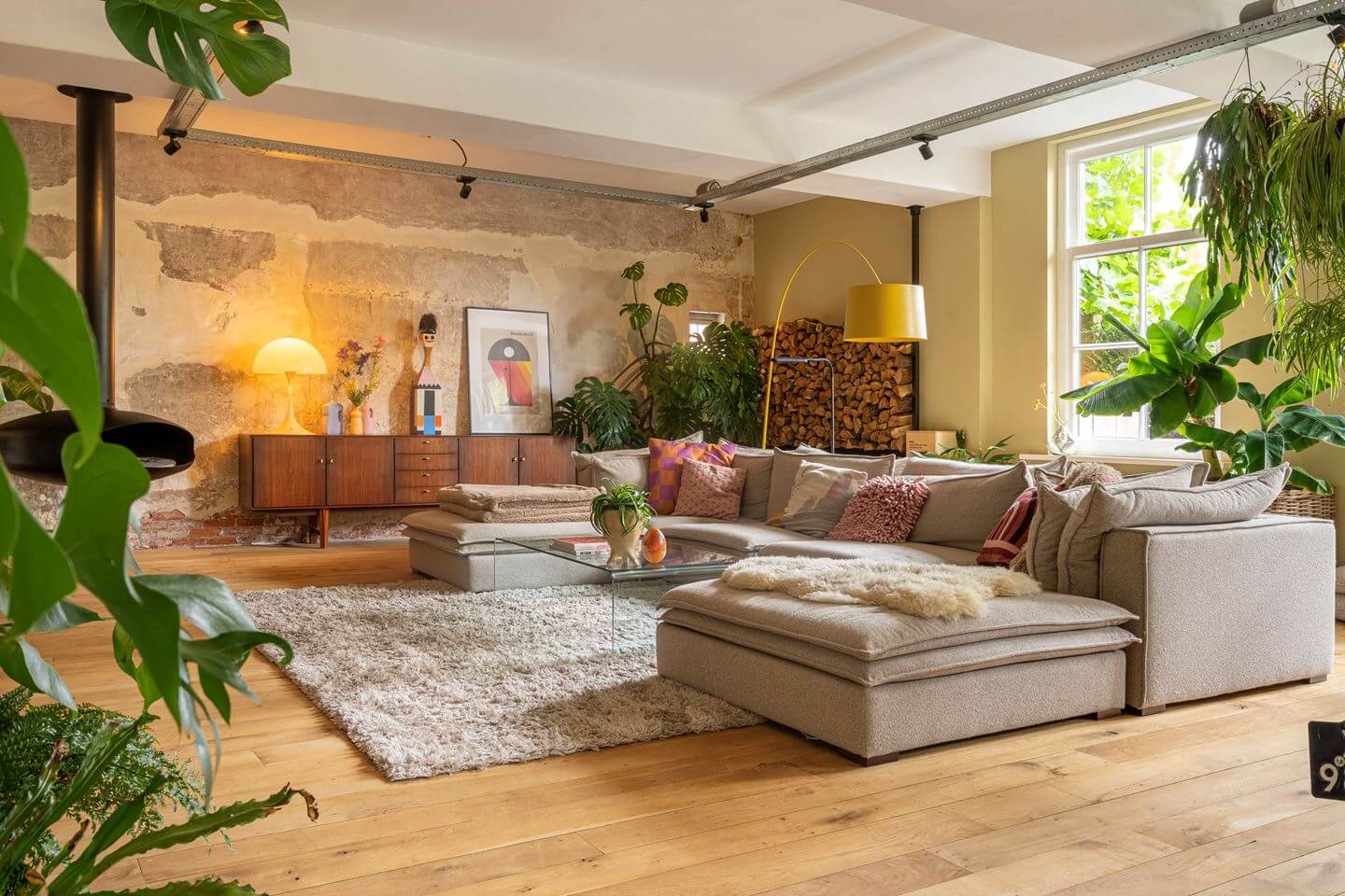 An Old Smokehouse Transformed Into a Modern Industrial Home 3 living room low ceiling plants
