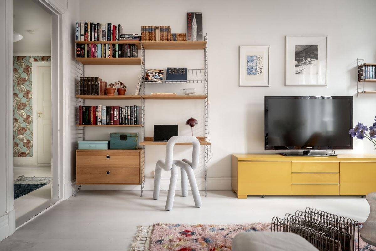 A Bright Swedish Apartment with Subtle Color Accents 7 living room shelves