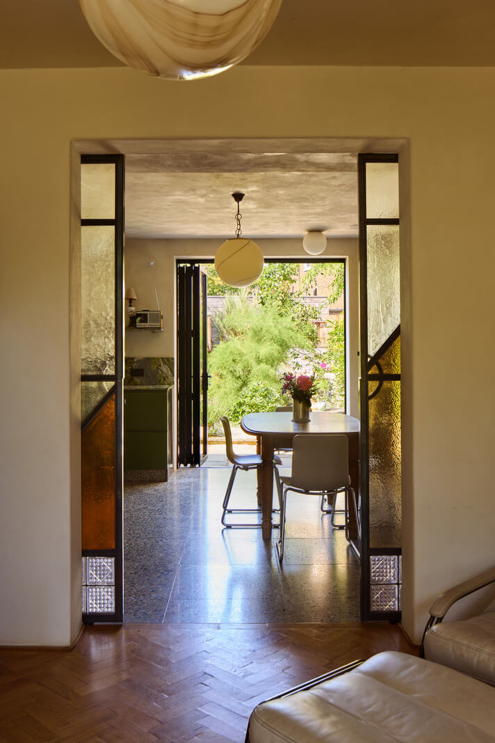 Stained Glass Doors and Terrazzo in a London Home 6 living room view into kitchen