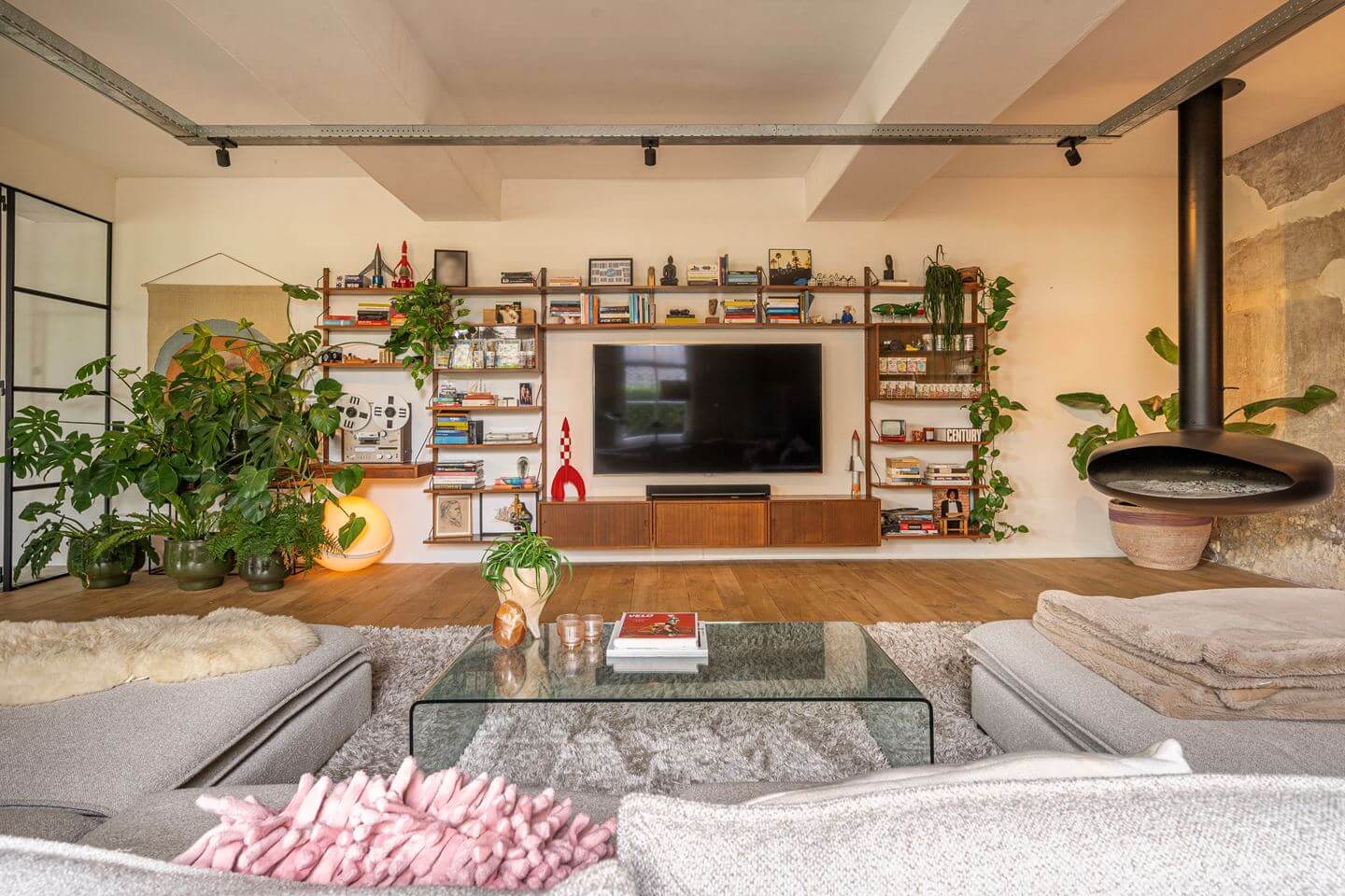 An Old Smokehouse Transformed Into a Modern Industrial Home 4 living room wall shelf system