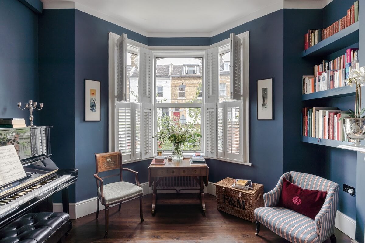 A London Apartment with a Deep Olive Green Kitchen 2 living room with bay window painted in hicks blue by little greene nordroom