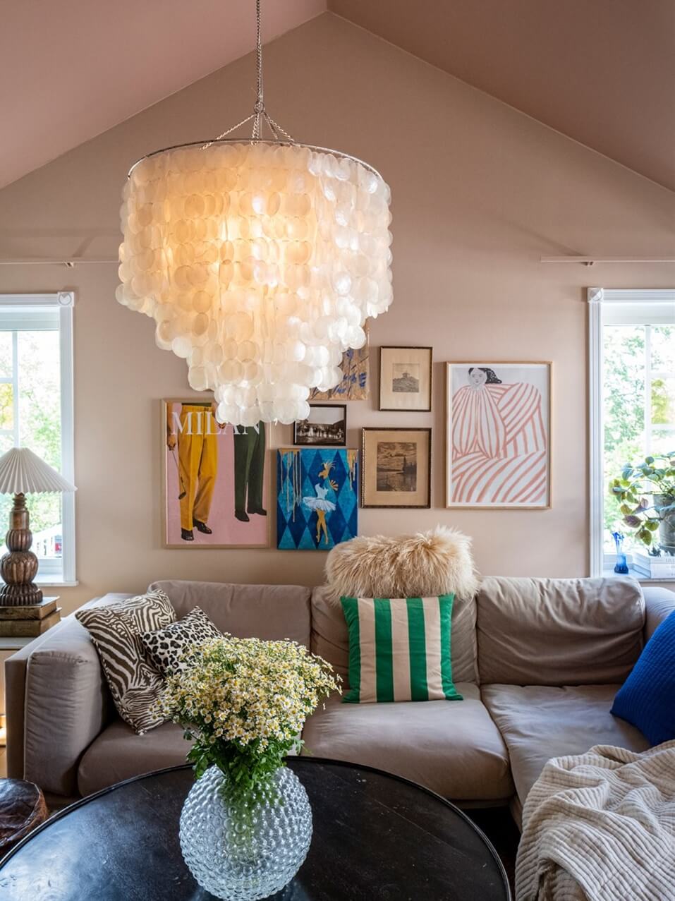 A White Swedish Villa with a Veranda and a Swimming Pool 9 living room with gallery wall