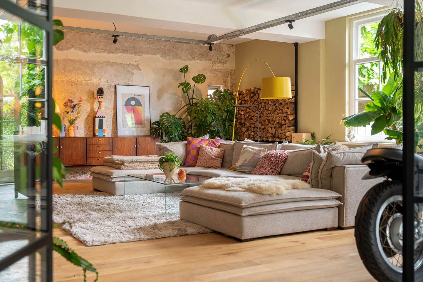 An Old Smokehouse Transformed Into a Modern Industrial Home 6 living room with large sofa and rug