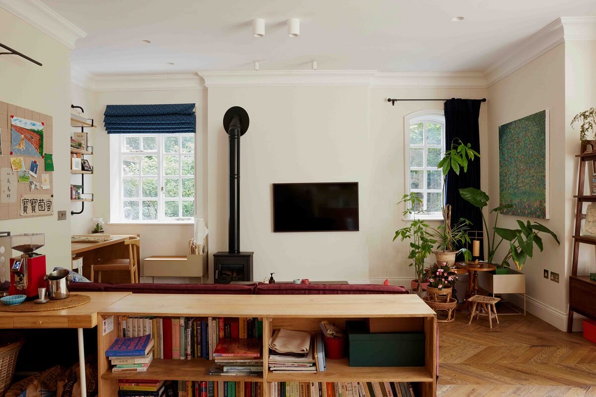 An Apartment with Rich Colors and Modern Design in a Victorian Mansion 7 living room with low cabinet room divider