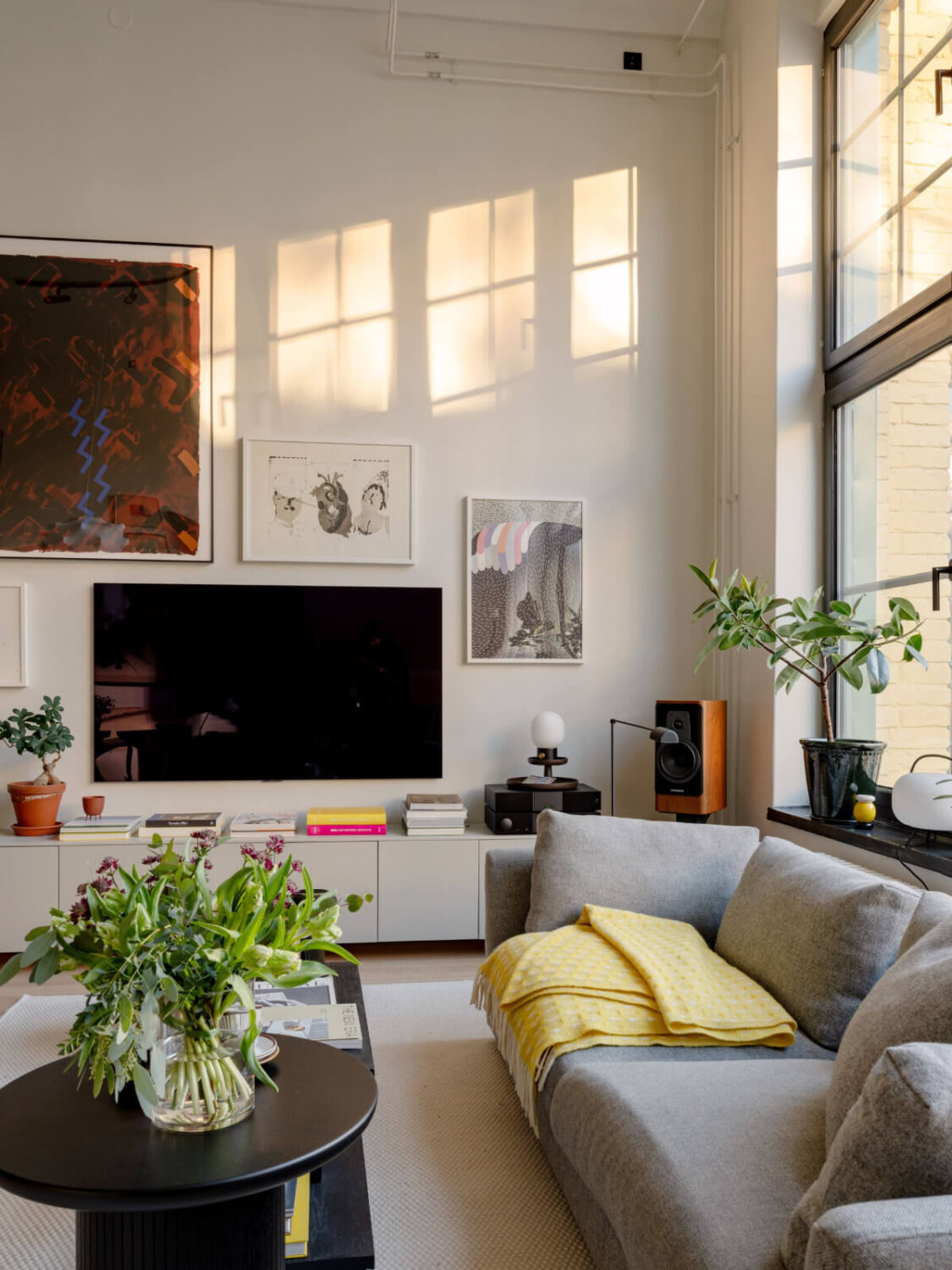 A Monochrome Loft with High Ceilings and Art 7 living room with low cabinets
