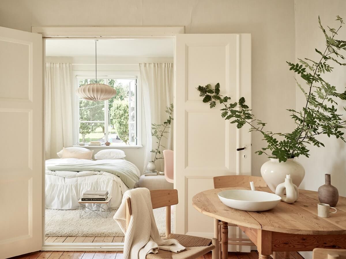 A Light Swedish Apartment with a Charming Kitchen 21 living room with mirror doors to bedroom