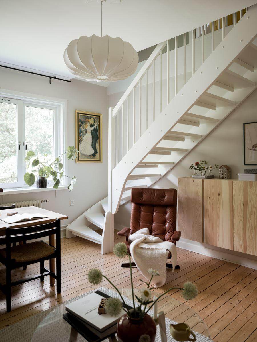A Beautiful Renovated Maisonette Home with a Calm Color Palette 8 living room with open staircase