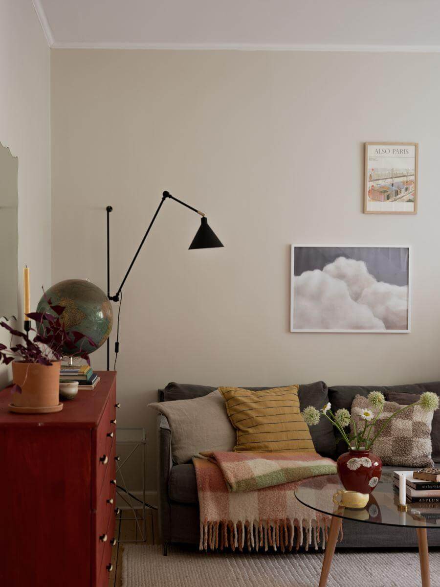 A Beautiful Renovated Maisonette Home with a Calm Color Palette 4 living room with red cabinet