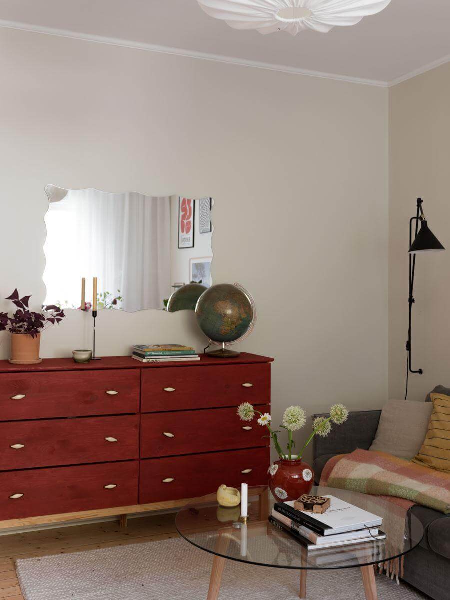 A Beautiful Renovated Maisonette Home with a Calm Color Palette 5 living room with red painted cabinets nordroom