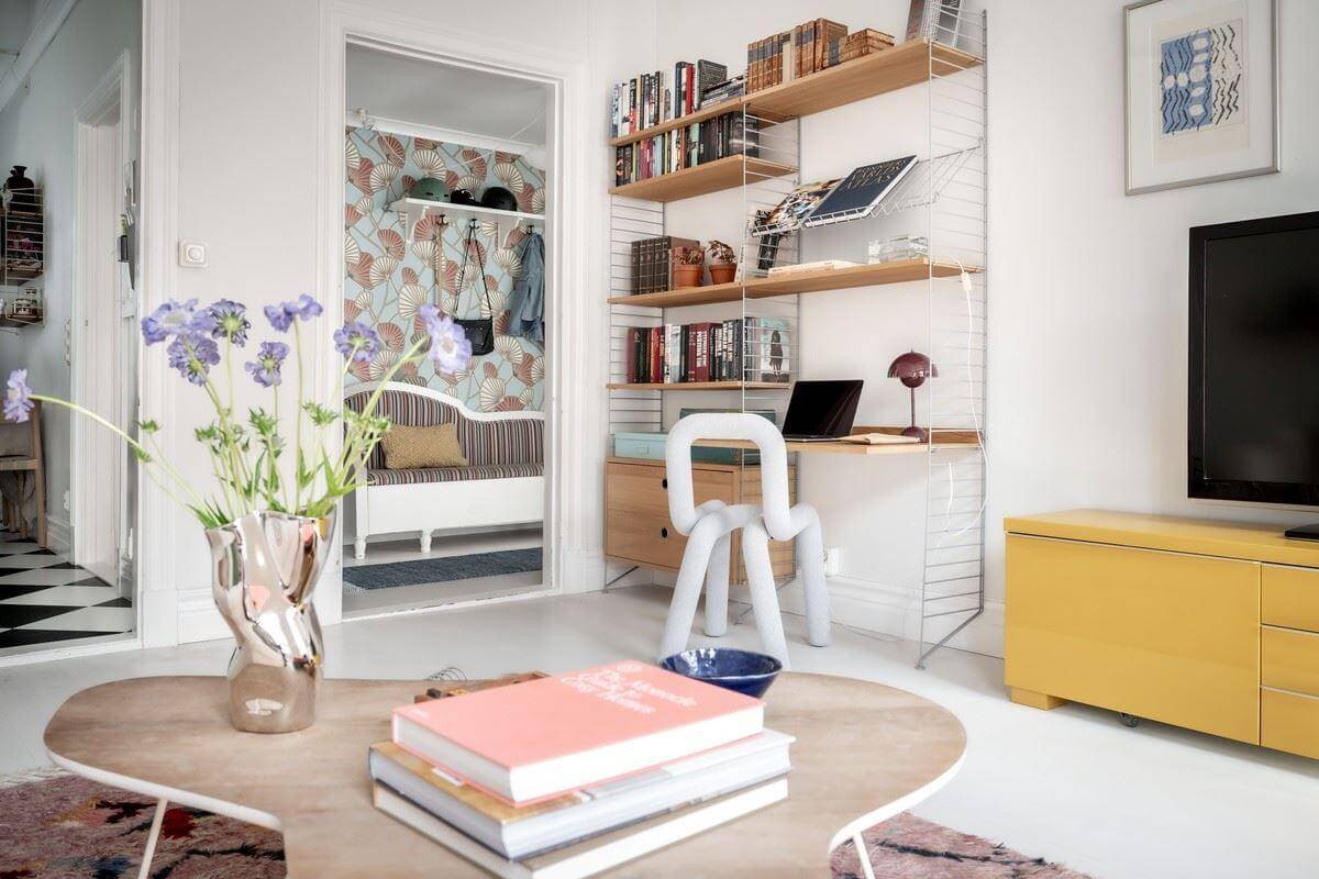 A Bright Swedish Apartment with Subtle Color Accents 9 living room with string shelves