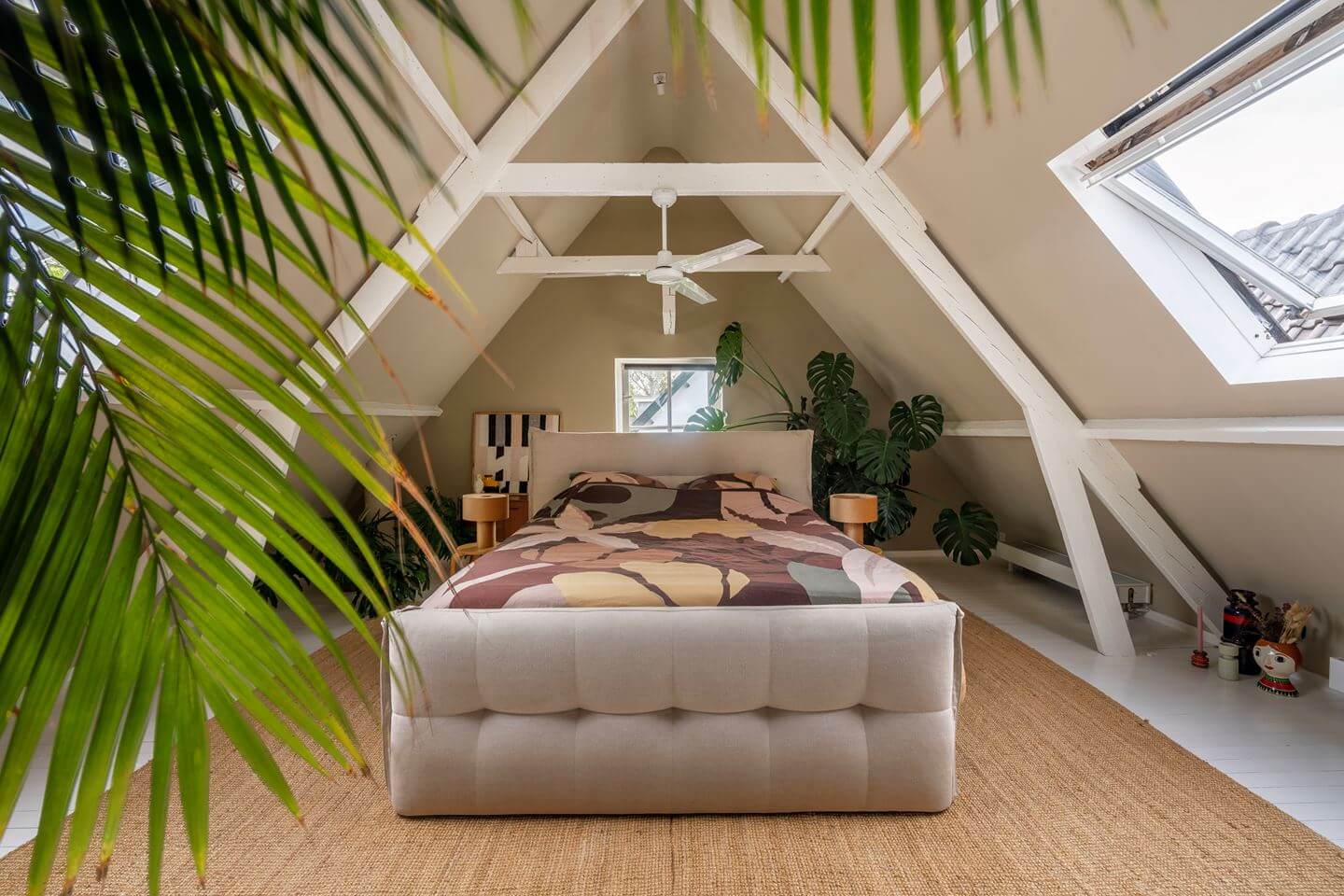 An Old Smokehouse Transformed Into a Modern Industrial Home 19 loft bedroom sloped ceiling