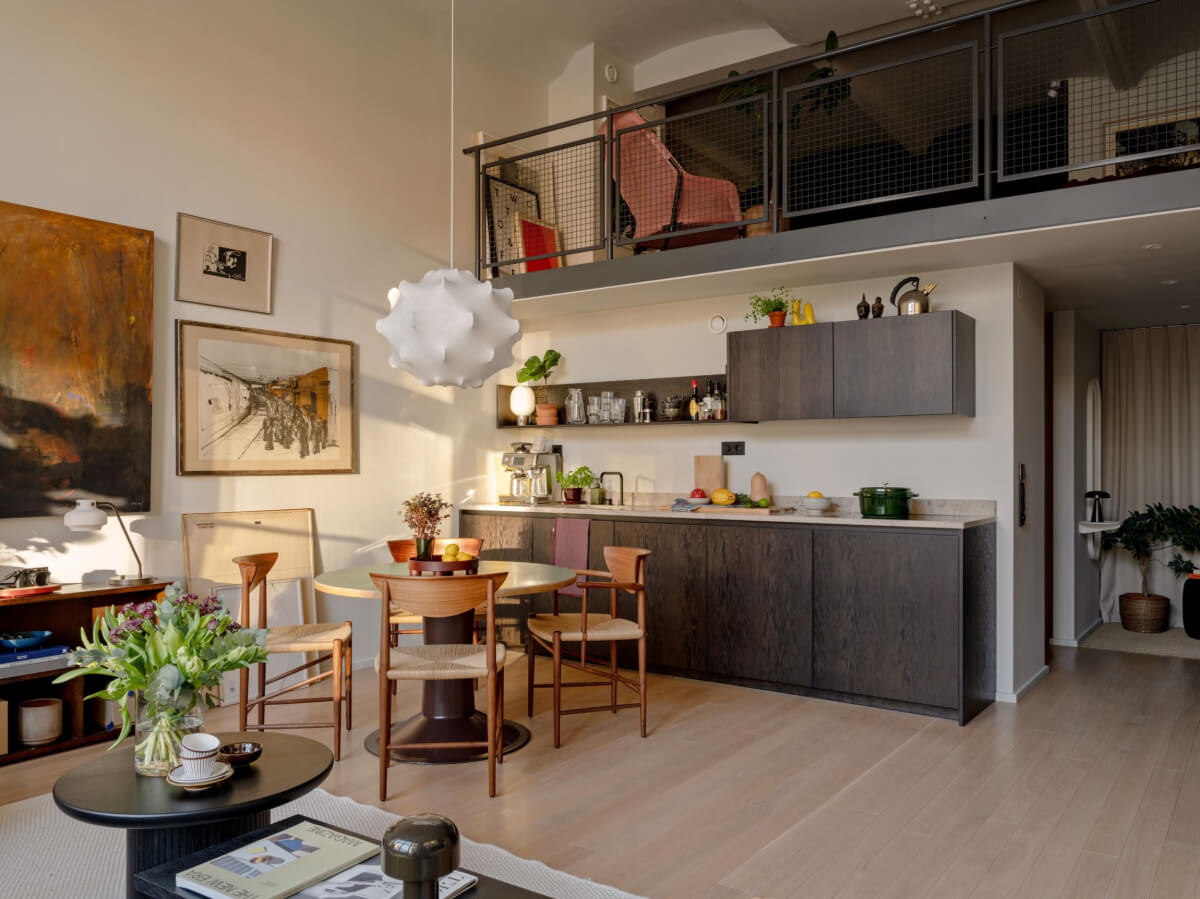 A Monochrome Loft with High Ceilings and Art 25 loft kitchen sunlight dark cabinets