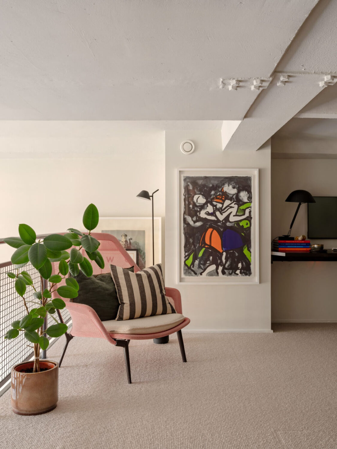 A Monochrome Loft with High Ceilings and Art 35 loft space pink armchair