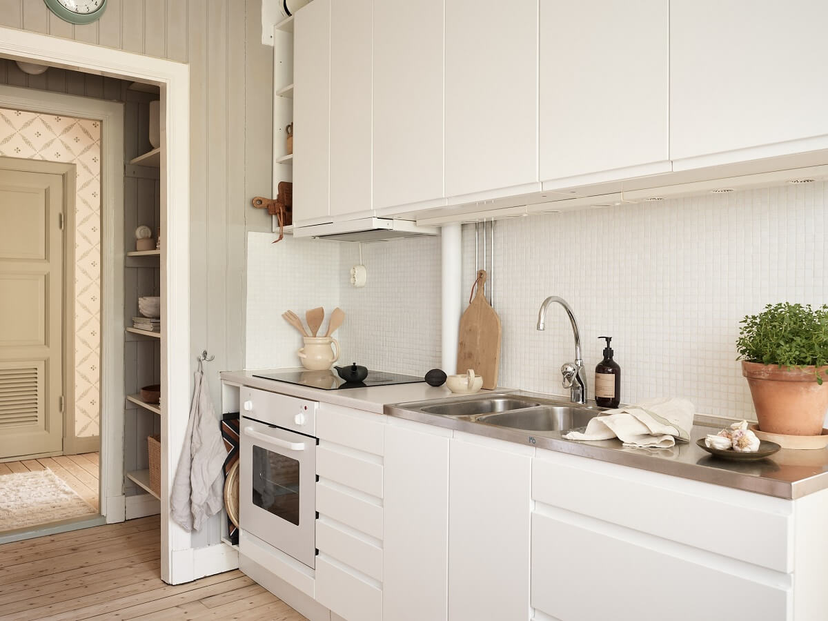 A Light Swedish Apartment with a Charming Kitchen 12 modern white kitchen