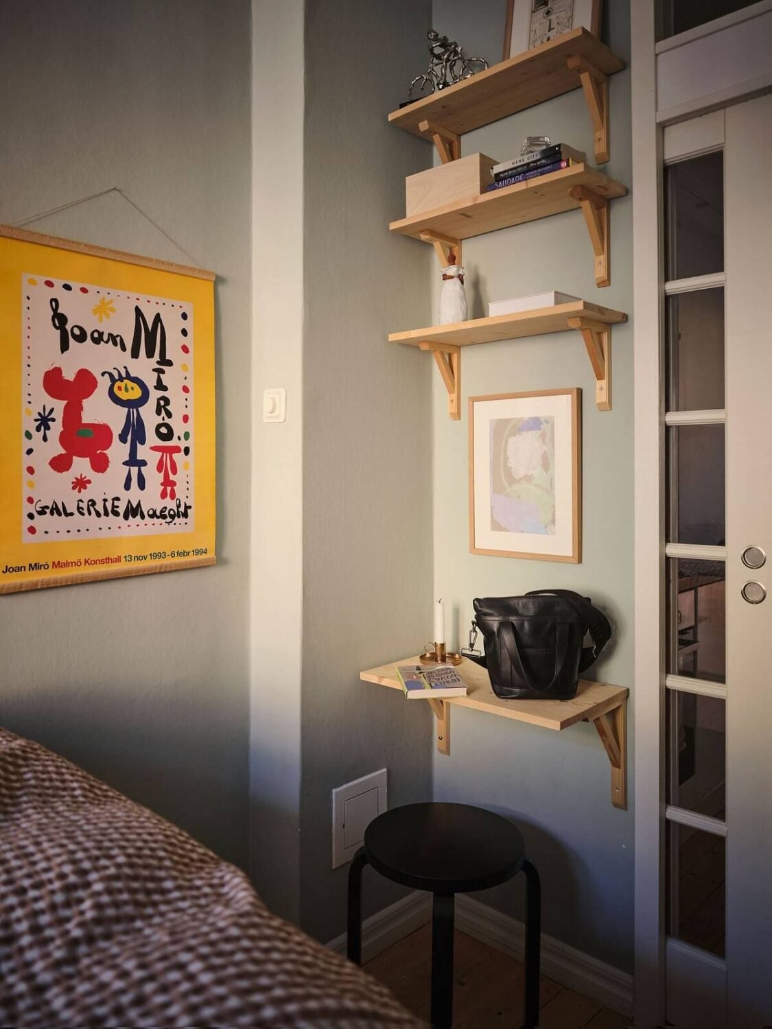 Muted Gray, Green, and Yellow Walls in a Stockholm Apartment 15 narrow bedroom with tiny desk shelves and stool