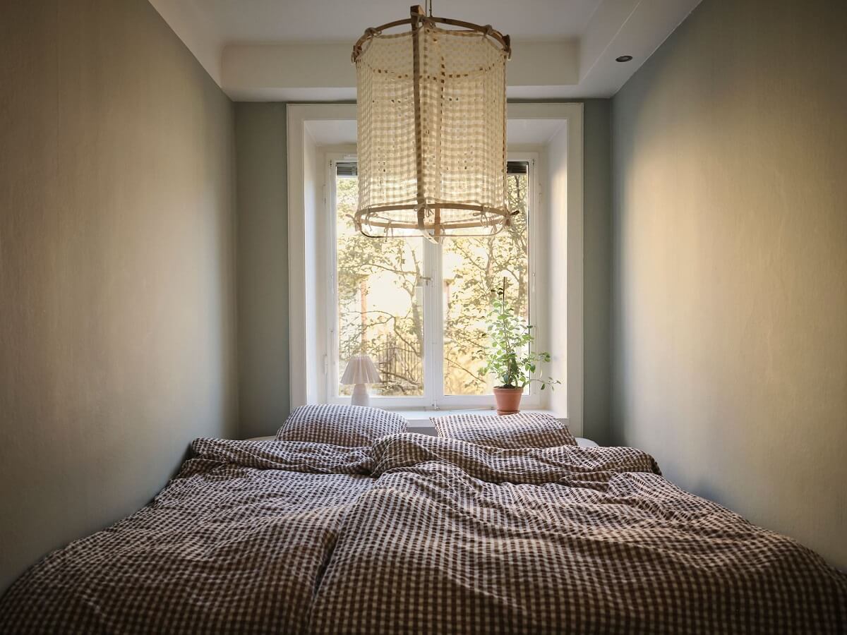 Muted Gray, Green, and Yellow Walls in a Stockholm Apartment 14 narrow double bedroom