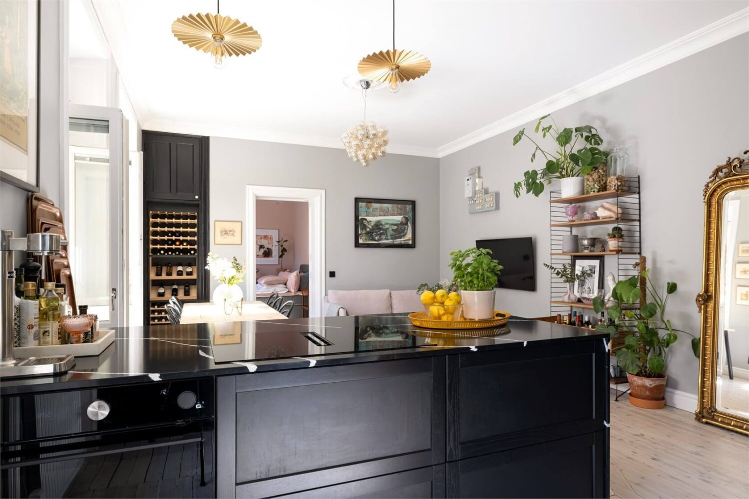 A Lovely Stockholm Apartment with a Black Kitchen and Pink Bedroom 5 open plan kitchen living space