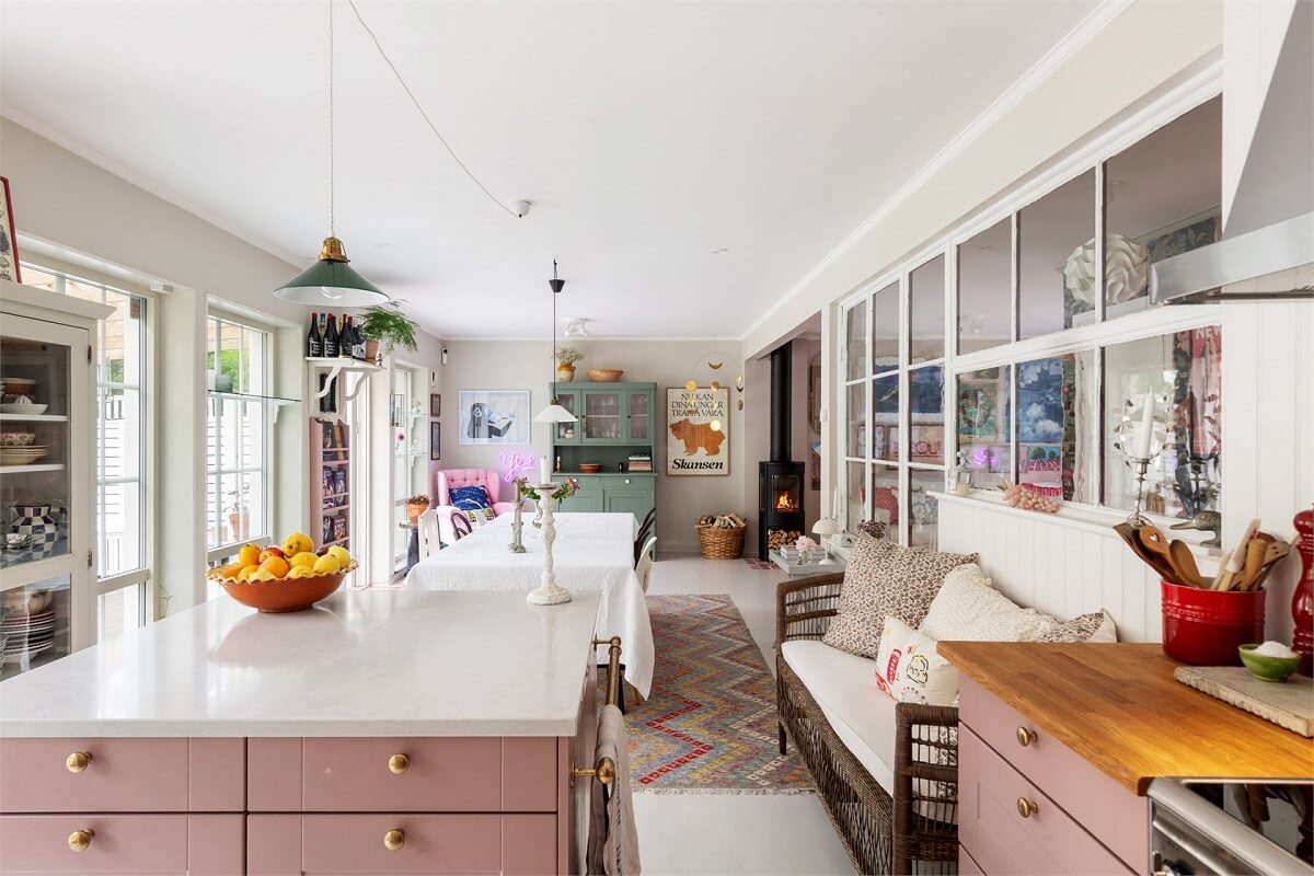 A Bright Open-Plan Swedish Home with a Pink Kitchen 14 open plan kitchen with pink cabinets A Bright Open-Plan Swedish Home with a Pink Kitchen