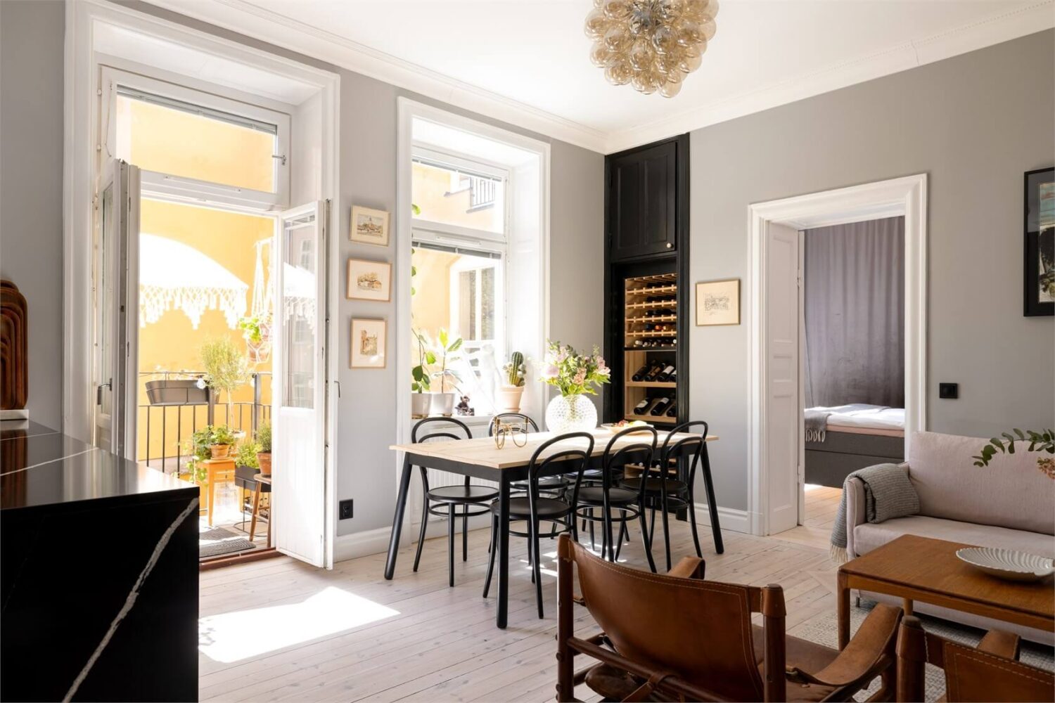 A Lovely Stockholm Apartment with a Black Kitchen and Pink Bedroom 16 open plan living space with gray walls nordroom