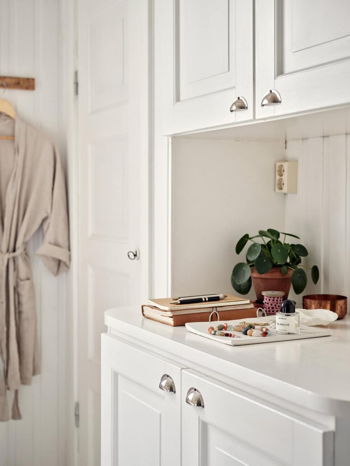 A Small Apartment with a Bright Open-Plan Kitchen & Bedroom 6 original built in cabinet