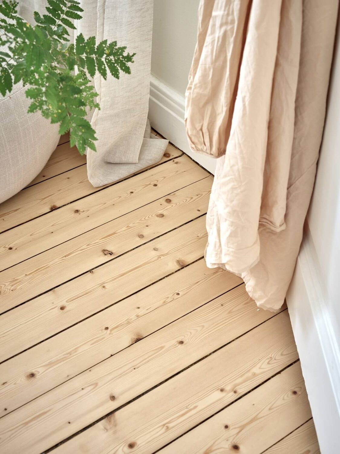 A Light Swedish Apartment with a Charming Kitchen 18 pine floor detail