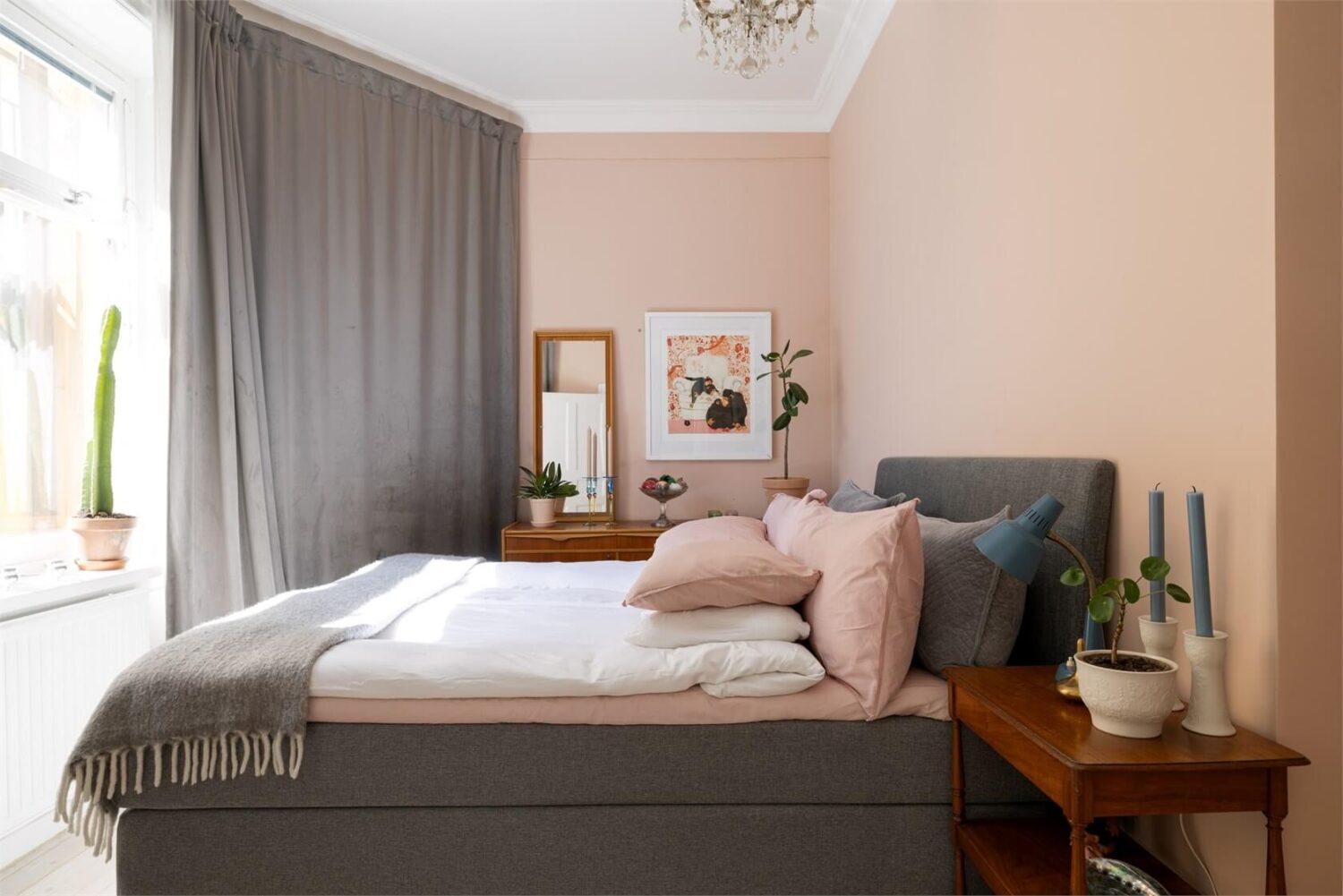 A Lovely Stockholm Apartment with a Black Kitchen and Pink Bedroom 19 pink bedroom with gray curtain