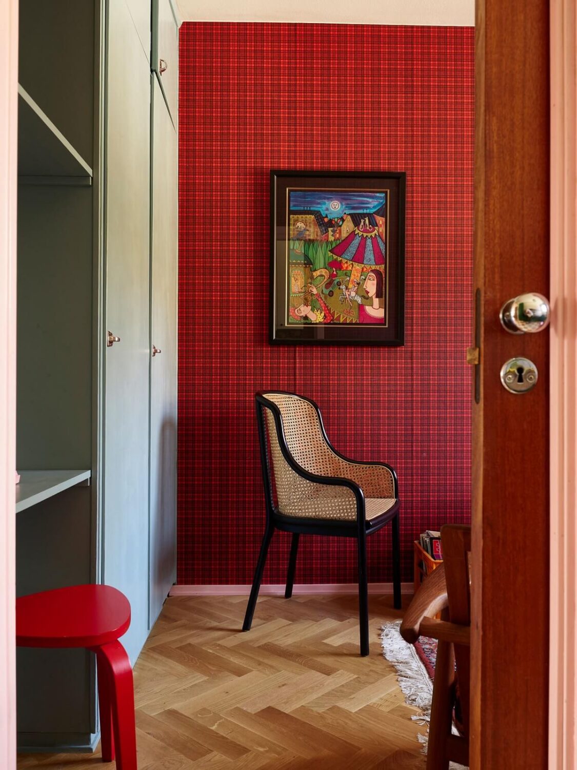 A Colorful Swedish Apartment Inspired by the 50s and 70s 18 red wallpaper and built in wardrobes nordroom