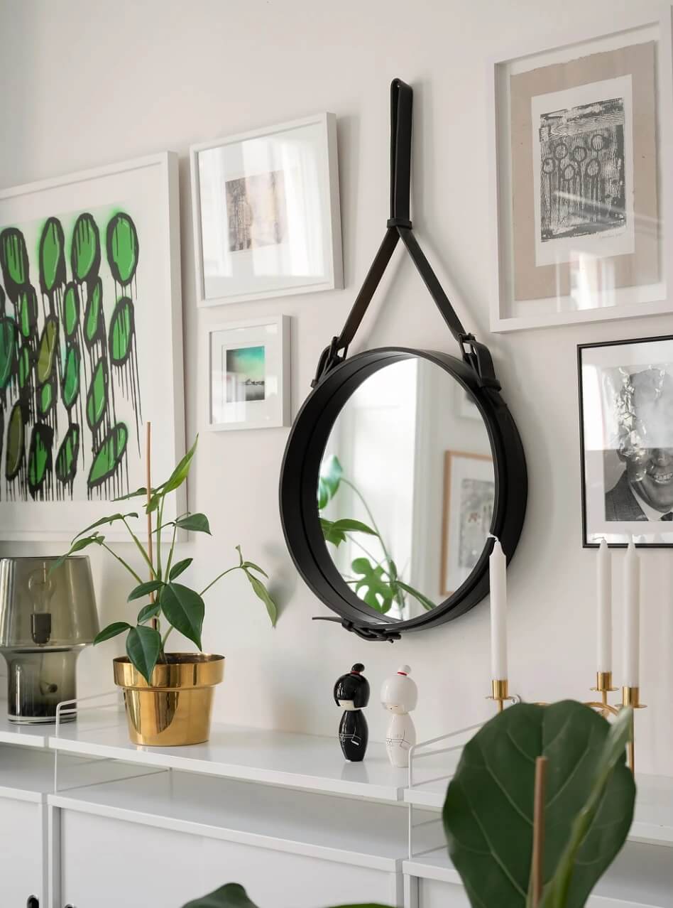 A Small Bright Scandinavian Studio Apartment 8 round mirror gallery wall