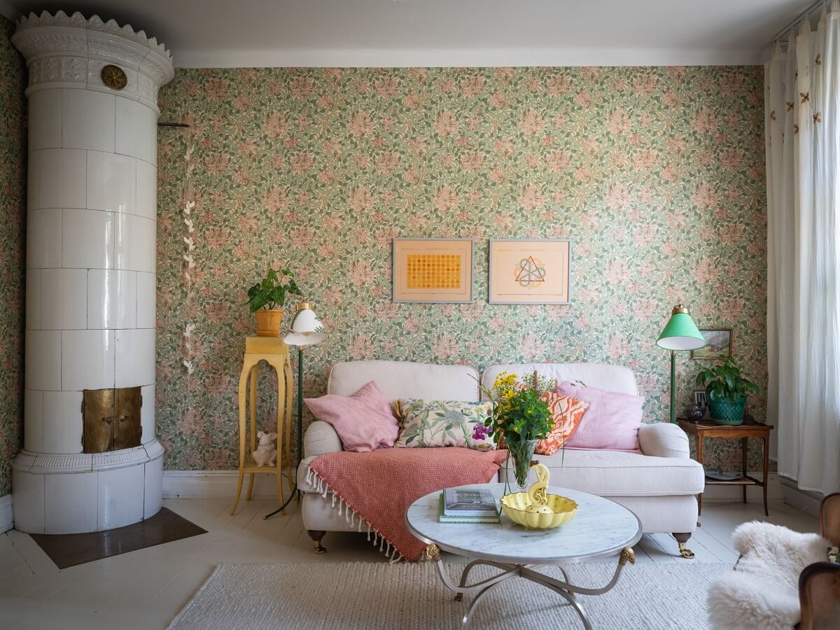 Charming Vintage Country Style in a Family Apartment in Sweden 1 scandi living room with round fireplace and wallpaper nordroom