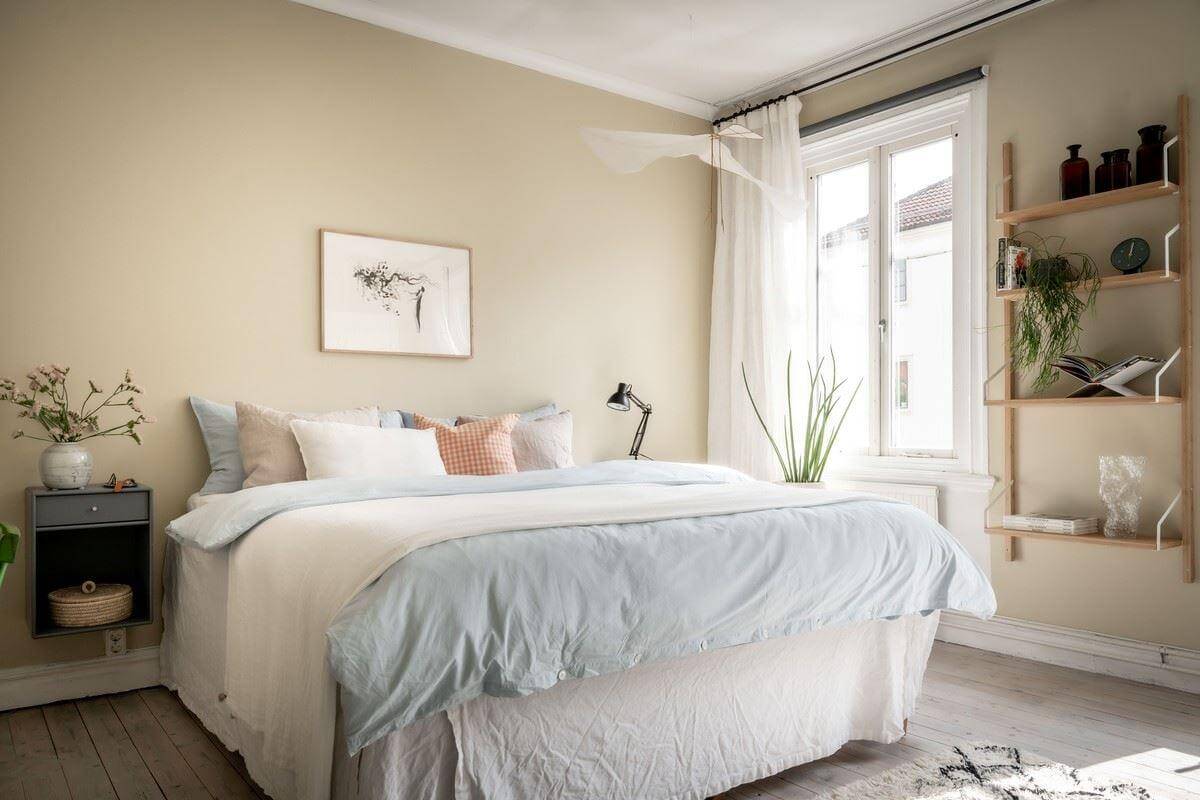 A Bright Swedish Apartment with Subtle Color Accents 16 scandinavian bedroom wuth neutral beige walls nordroom
