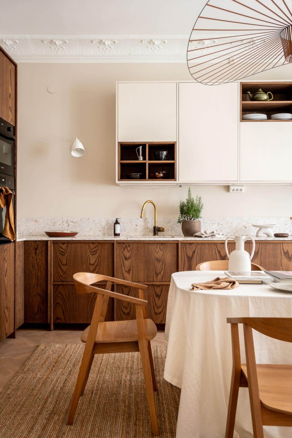 A Spacious Renovated Apartment with a Light Pink Living Room 12 scandinavian kitchen with dining table nordroom