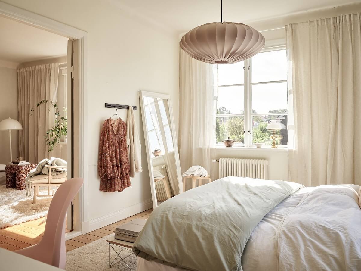 A Light Swedish Apartment with a Charming Kitchen 16 serene light colored bedroom