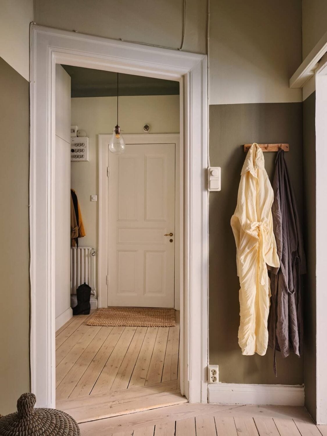 A Small Apartment with Calm Brown, Green, and Yellow Walls 13 small bedroom with hooks