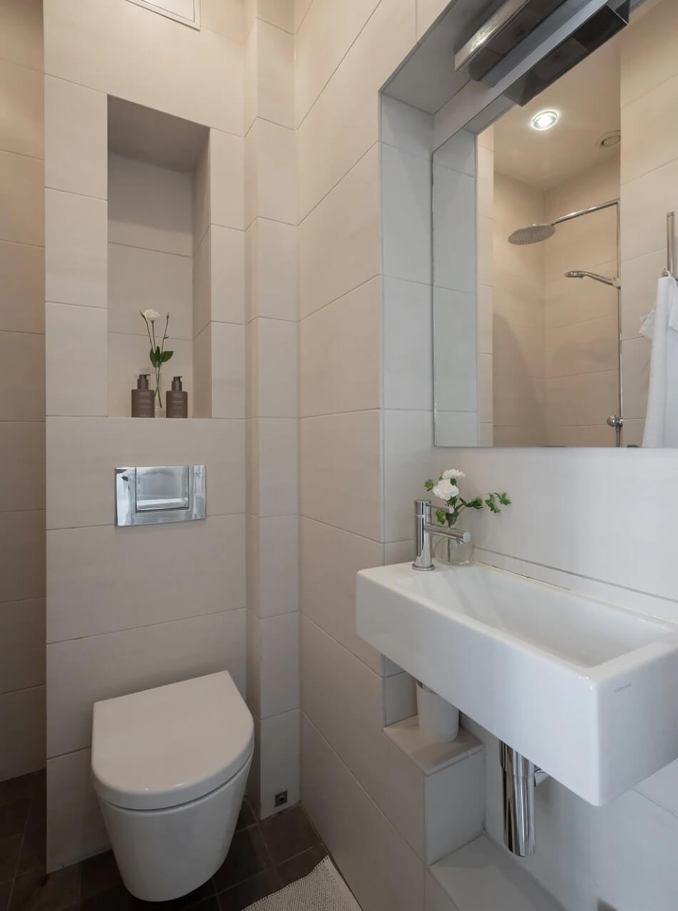 A Small Bright Scandinavian Studio Apartment 11 small light gray bathroom with storage niche nordroom
