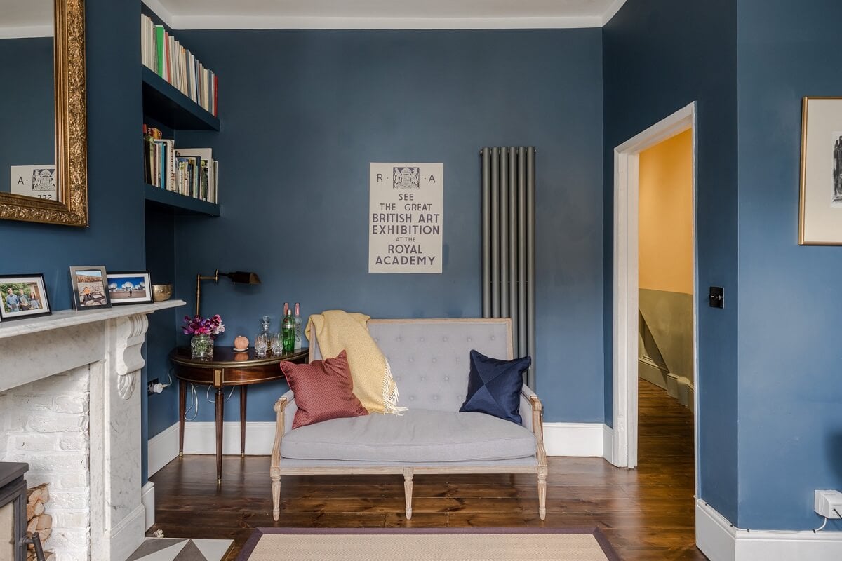 A London Apartment with a Deep Olive Green Kitchen 3 small living room with walls painted in hicks blue by little greene nordroom