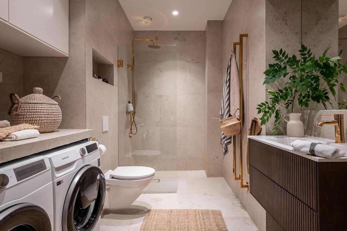 A Spacious Renovated Apartment with a Light Pink Living Room 25 spacious bathroom with gray tiles walk in shower nordroom