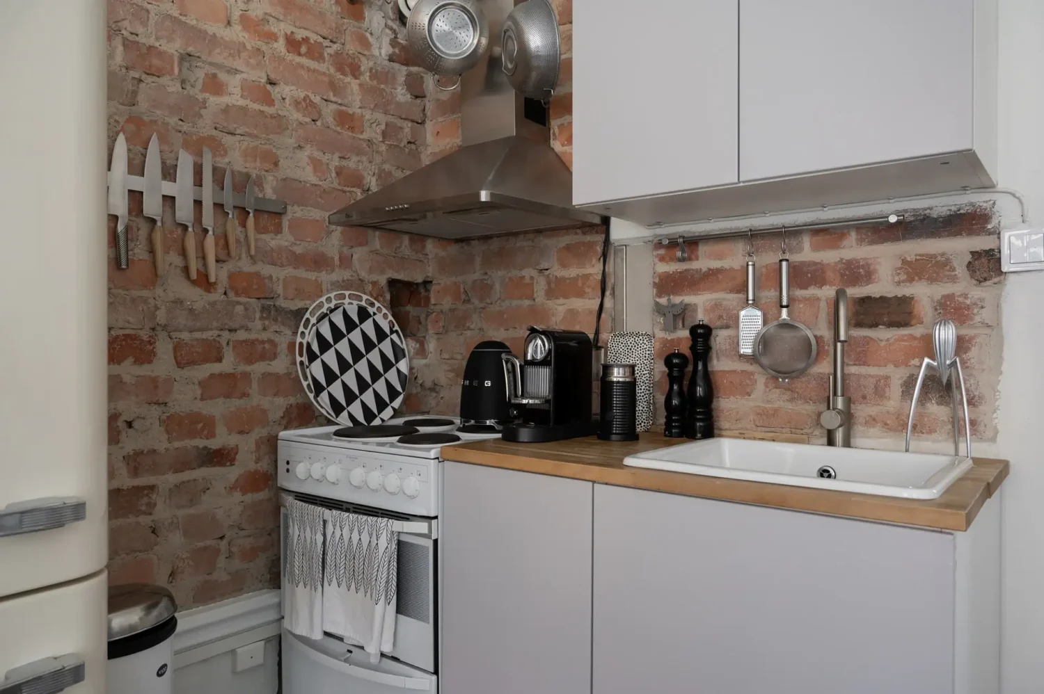 A Small Bright Scandinavian Studio Apartment 10 studio apartment kitchen with brick walls nordroom