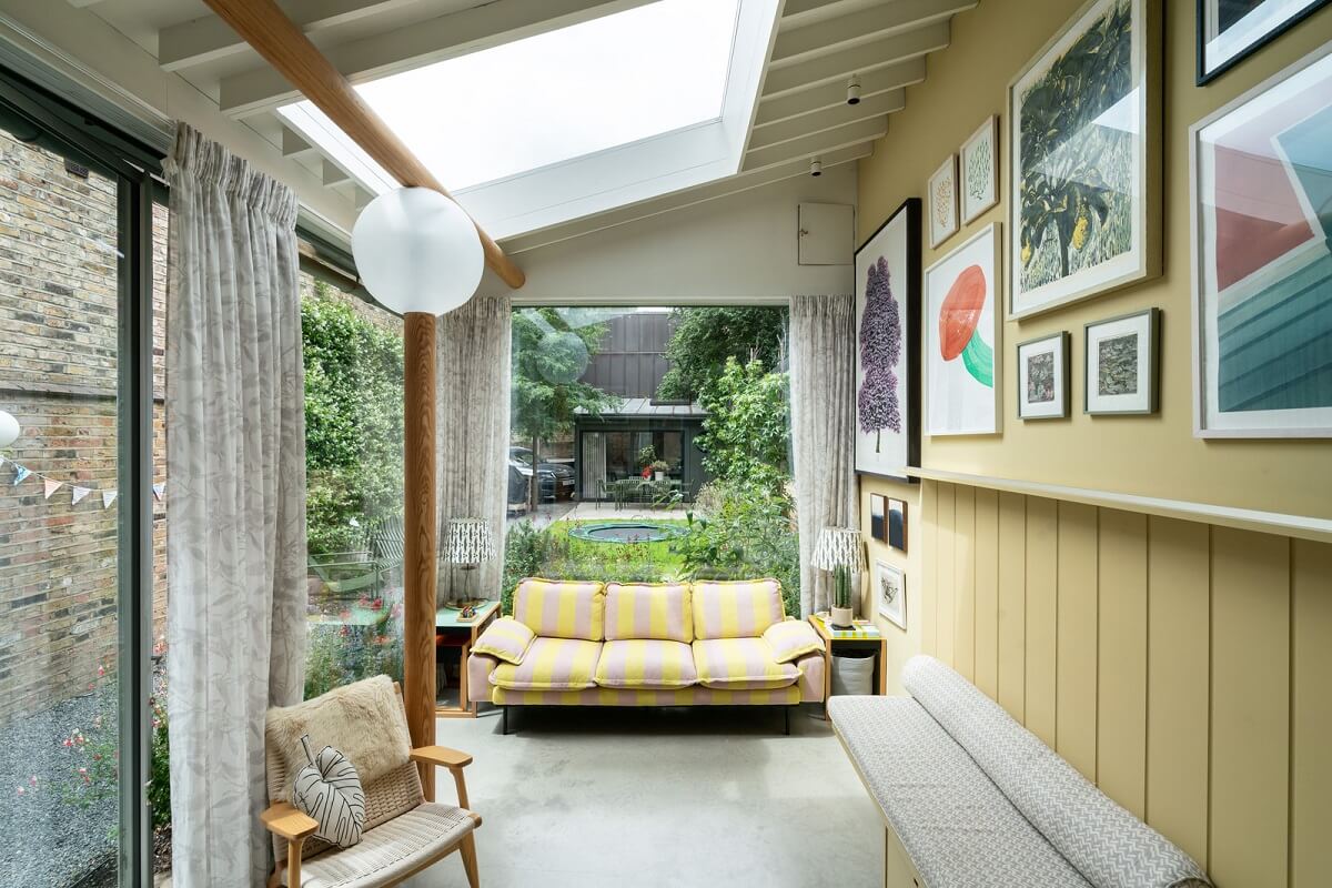 A Beautiful London Family Home with Colorful Accents 10 sun room with muted yellow wall nordroom
