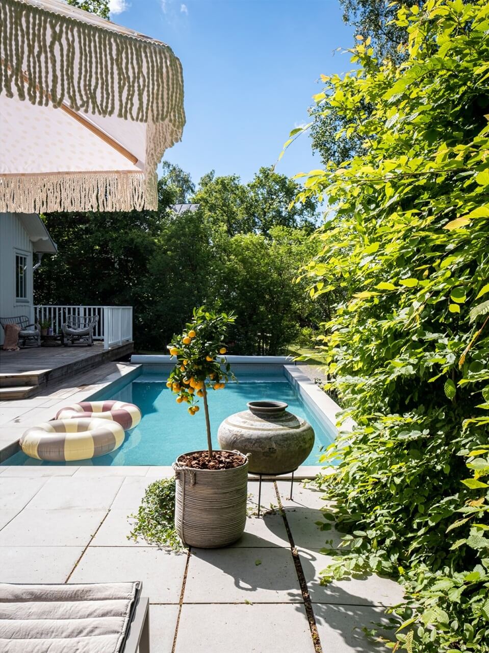 A White Swedish Villa with a Veranda and a Swimming Pool 29 swedish garden with swimming pool nordroom